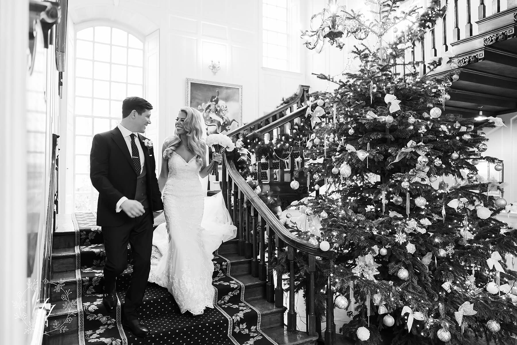 Christmas wedding at Gosfield Hall with Christmas tree and staircase